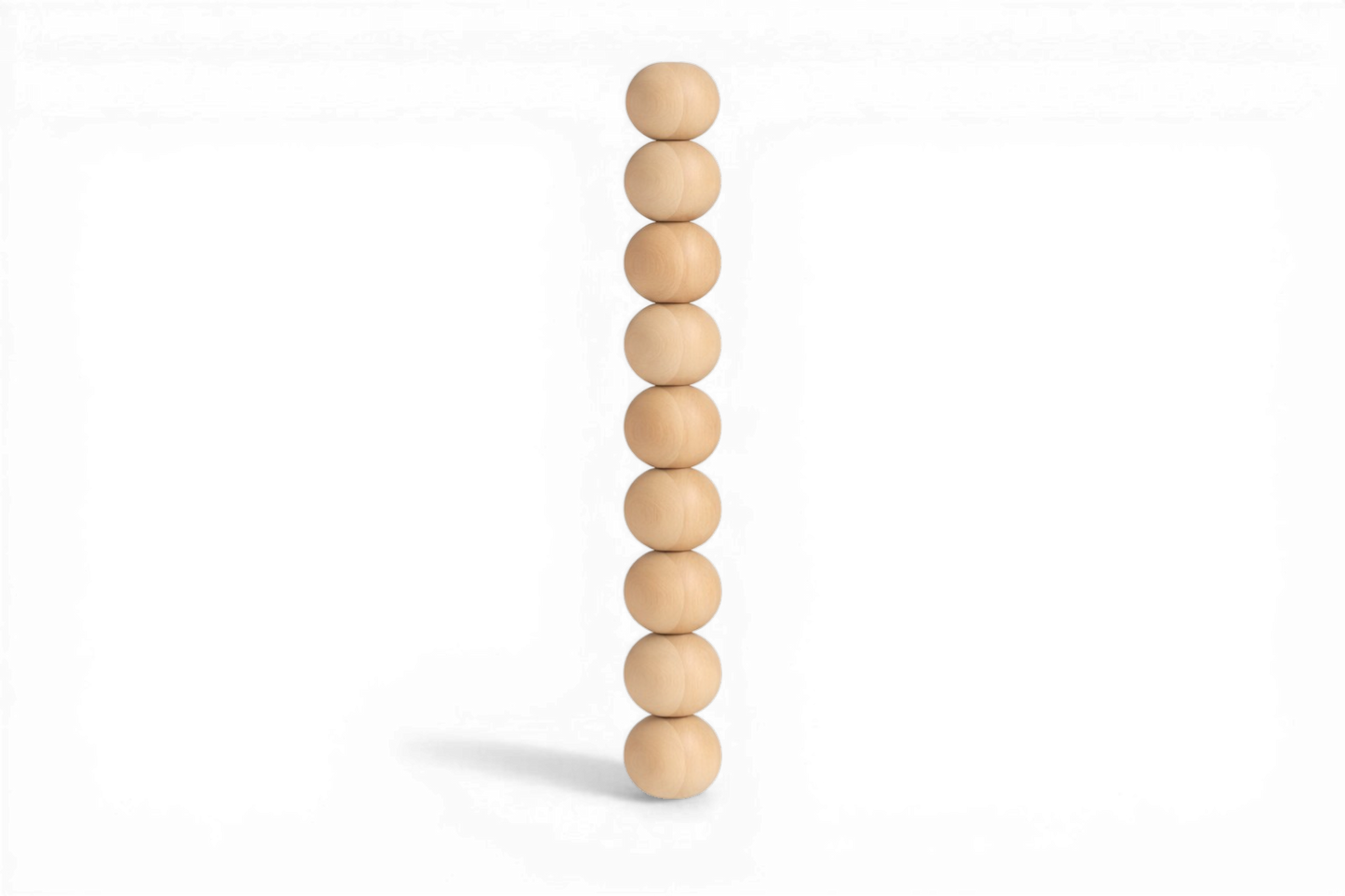 Stack of wooden beads on a white background