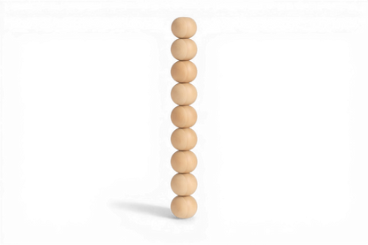 Stack of wooden beads on a white background